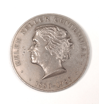 Silver coin with profile of short-haired woman turned to the left