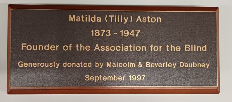 Plaque accompanying Tilly Aston relief