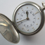 Opened watch with braille markers and numbers on watch face