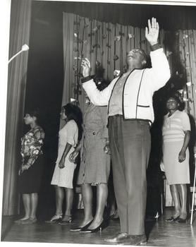 Performers on stage during rehearshal