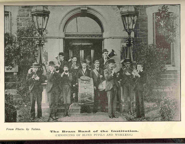 12 musicians holding their instruments ready to play outside the RVIB building