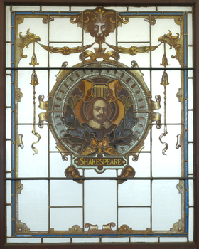 Three animals holding a shield featuring an image of William Shakespeare