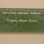 Stippled green tinted glass plaques with names.