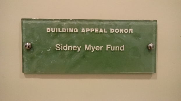 Stippled green tinted glass plaques with names.