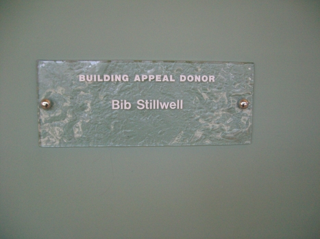 Stippled green tinted glass plaques with names 