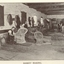 Men making cane chairs and baskets in a workshop