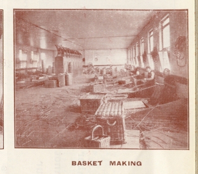 Men standing behind their stations in the basket making workshop