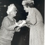 Mrs Tutton handing a badge (?) to an auxiliary member