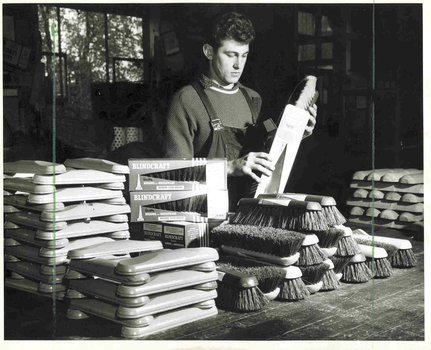 Man placing brushes into packaging