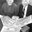 Molly Miller and Percy Raufer look at the newspapers in the time capsule