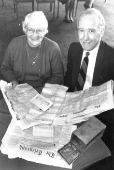 Molly Miller and Percy Raufer look at the newspapers in the time capsule