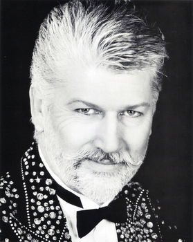 Man with beard wearing diamante jacket
