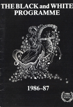 White drawing on black background of lady in dress on horse surrounded by flowers