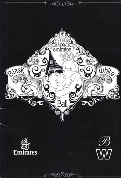 White drawing on black background of male and female about to kiss under Eiffel Tower