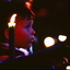 Boy sitting in a lap facing stage