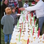 People buying candles at Carols by Candlelight