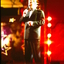 Denis Walter singing on stage