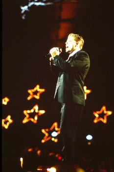 David Dixon singing on stage