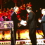 Ray Martin shakes hands with another man after a short speech