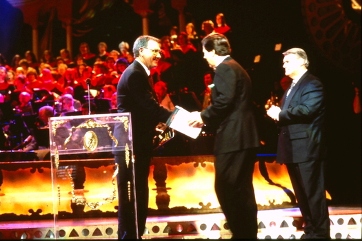 Ray Martin shakes hands with another man after a short speech