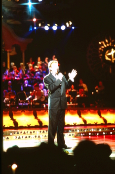 Male singer on stage at Carols