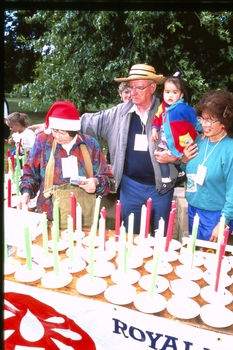 Volunteers helping sell candles at the bowl