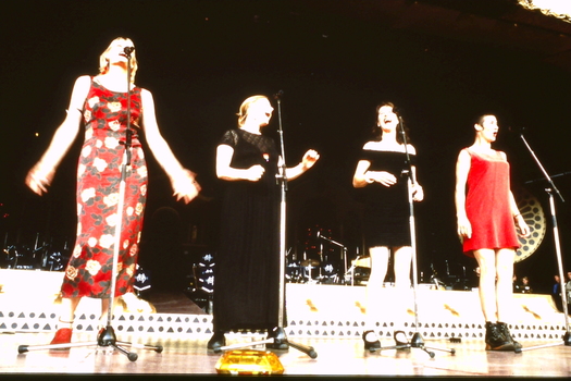 Four female singers on stage
