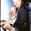 Dr Nikolai Jeuniewic holds baby Lexie backstage (?)