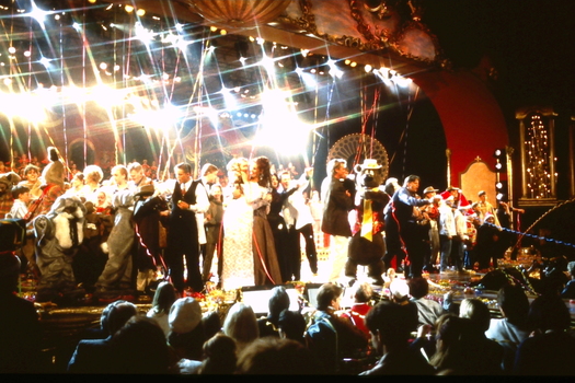 On stage at the conclusion of the night, performers covered in streamers