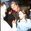 Peter Cupples watches Geoff Harvey speak to a young girl (possibly his daughter)