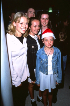 Jo Beth Taylor poses for a photograph with fans backstage