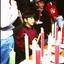 Boys buying candles from the stall