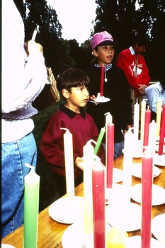Boys buying candles from the stall