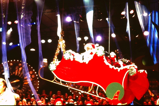Santa in his sled on stage