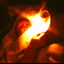 Child wrapped in blankets holding candle