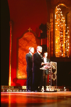 Bernie Brookes at lectern on stage