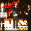 Ray Martin at lectern on stage 