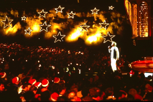 Crowds watch Peter Cupples on stage