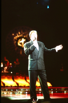 Singer on stage performing at Carols