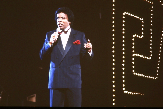 Kamahl on stage at Carols by Candlelight in 1985