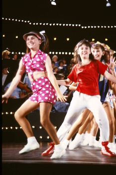 Children dancing on stage at Carols by Candlelight