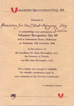 Buff textured paper with black writing and red V character