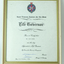 White paper with crest and black writing - Dr Alan Crook