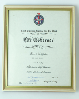 White paper with crest and black writing - Dr Alan Crook