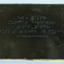 Braille writing on brown plaque