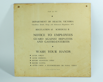 Cream sign with black lettering attached to board