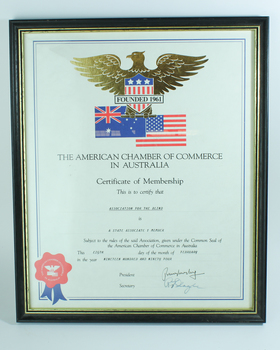 Certificate with Australian and USA flags below a gold eagle