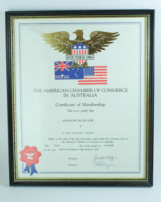 Certificate with Australian and USA flags below a gold eagle