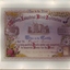 Coloured certificate with William Street building, flowers and images
