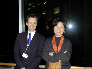 Karl Hughes and Jennifer Yang in the corridor